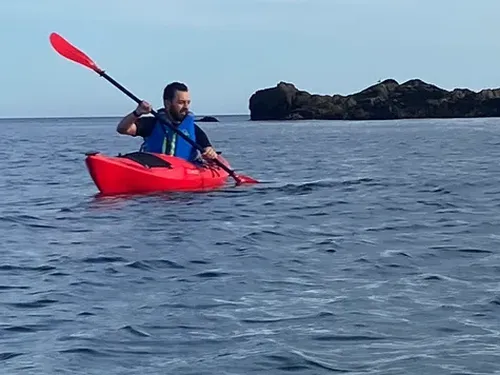 Man kayaking in sea